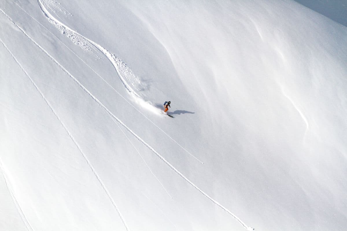 Local guides skinning up a backcountry ridline in Japan